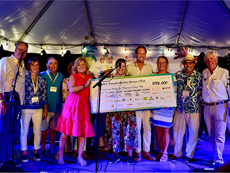 Brad Kappel photographed with lead sponsors at the 2022 Annapolis Maritime Museum’s Boatyard Beach Bash event.